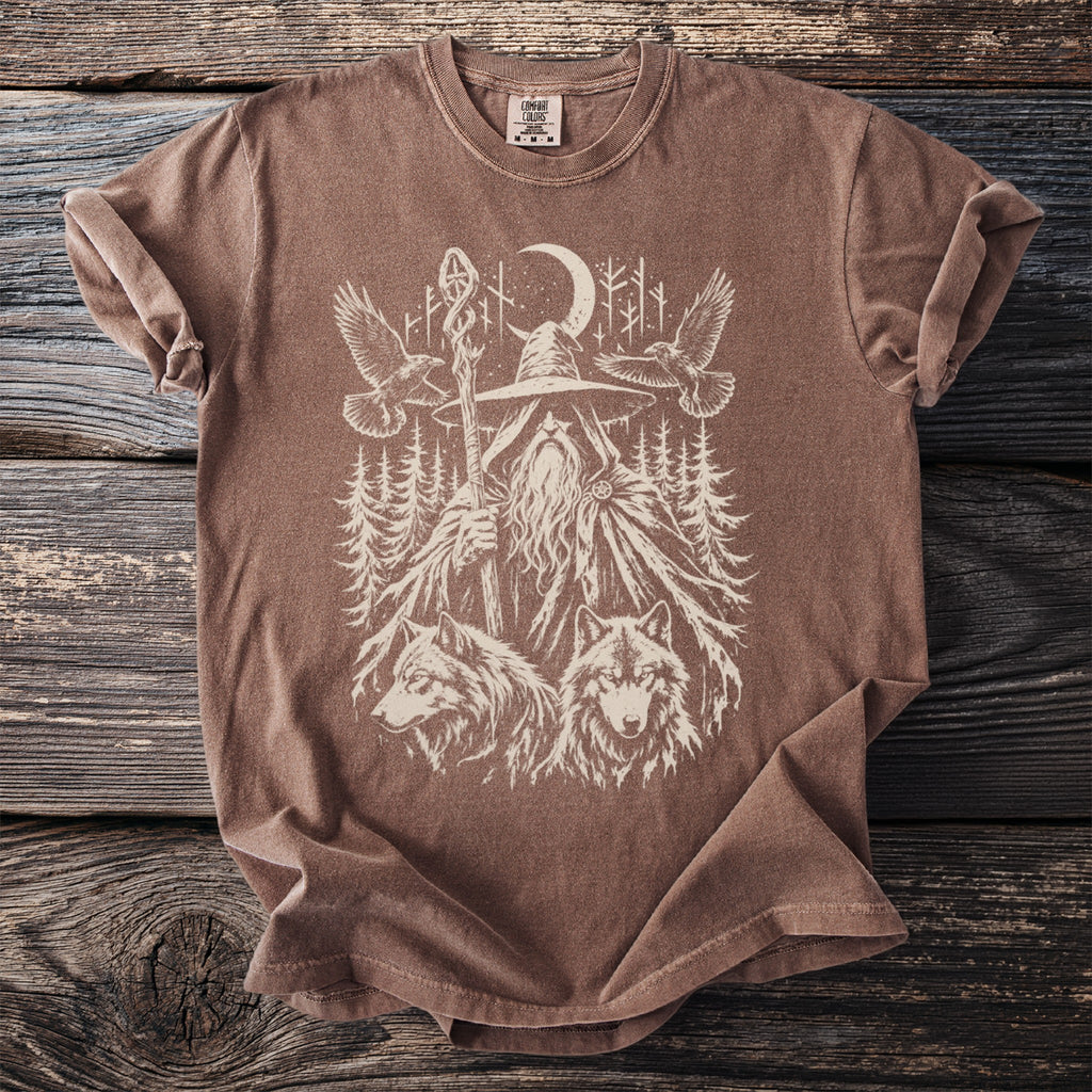 Brown t-shirt with mystical graphic of a wizard, wolves, eagles, and moonlit forest.