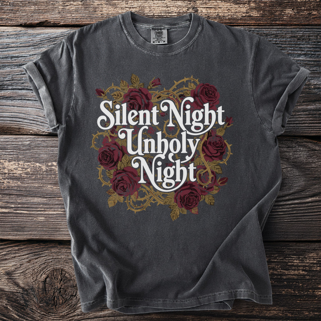 Dark t-shirt with white text "Silent Night Unholy Night" and red roses.
