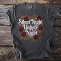Dark t-shirt with white text "Silent Night Unholy Night" and red roses.