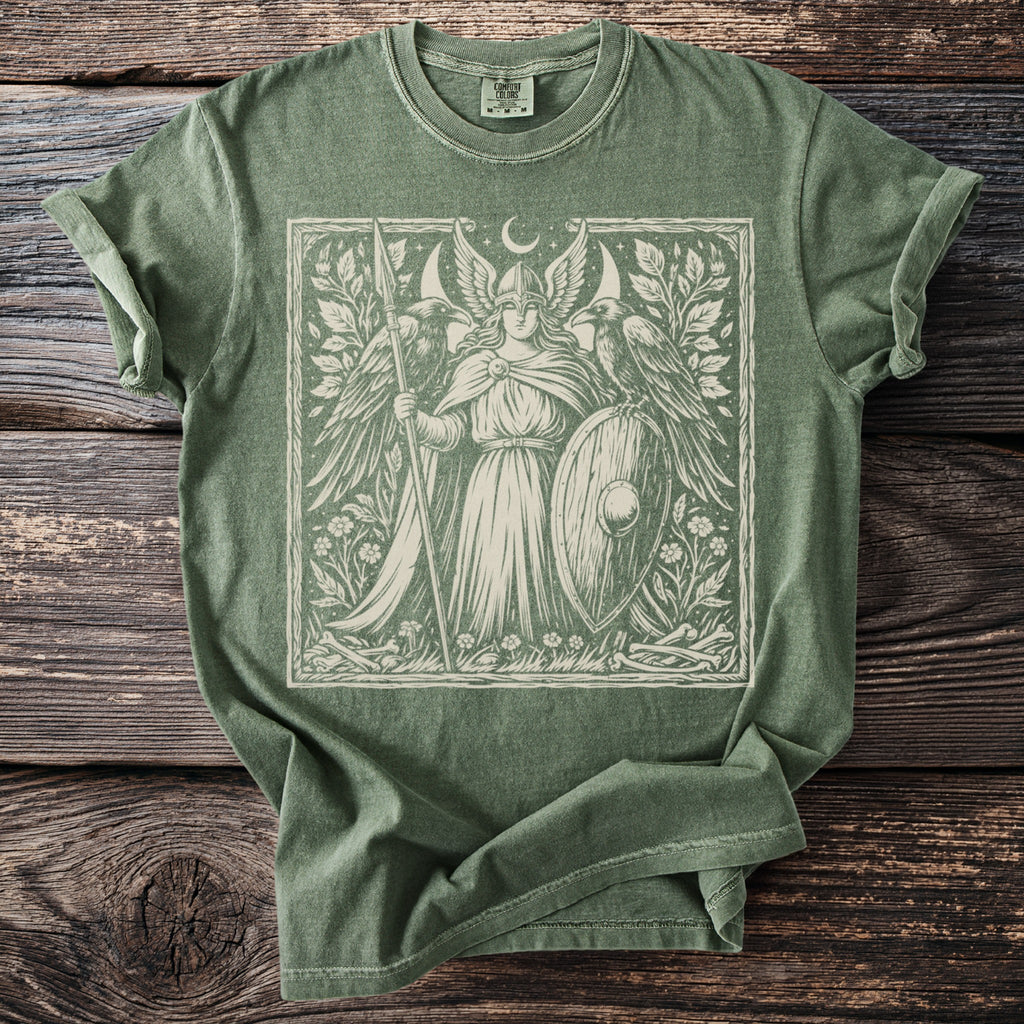 Green t-shirt with a winged warrior and ravens graphic.
