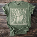 Green t-shirt with a winged warrior and ravens graphic.