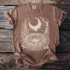 Brown t-shirt with a celestial forest scene graphic in cream.