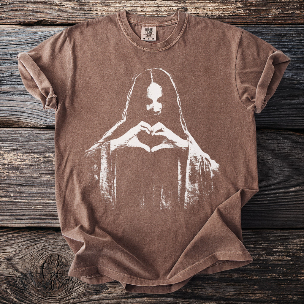 Brown t-shirt with white graphic of a person forming a heart with their hands.