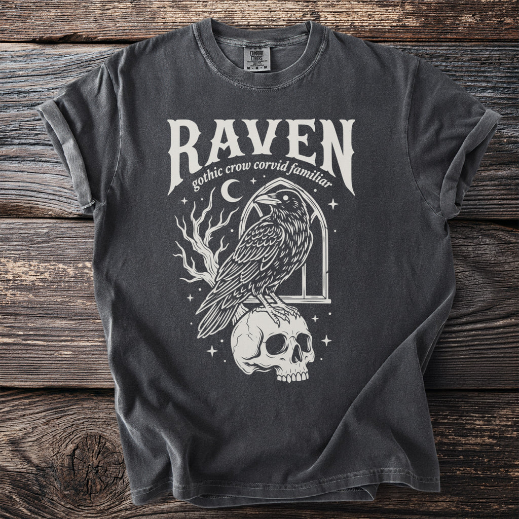 T-shirt with "Raven gothic crow corvid familiar" text and a raven on a skull.