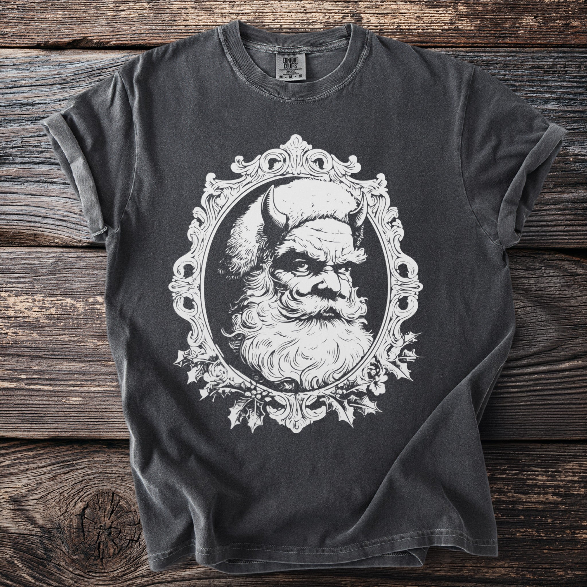 Dark t-shirt with a graphic of Krampus in an ornate frame.