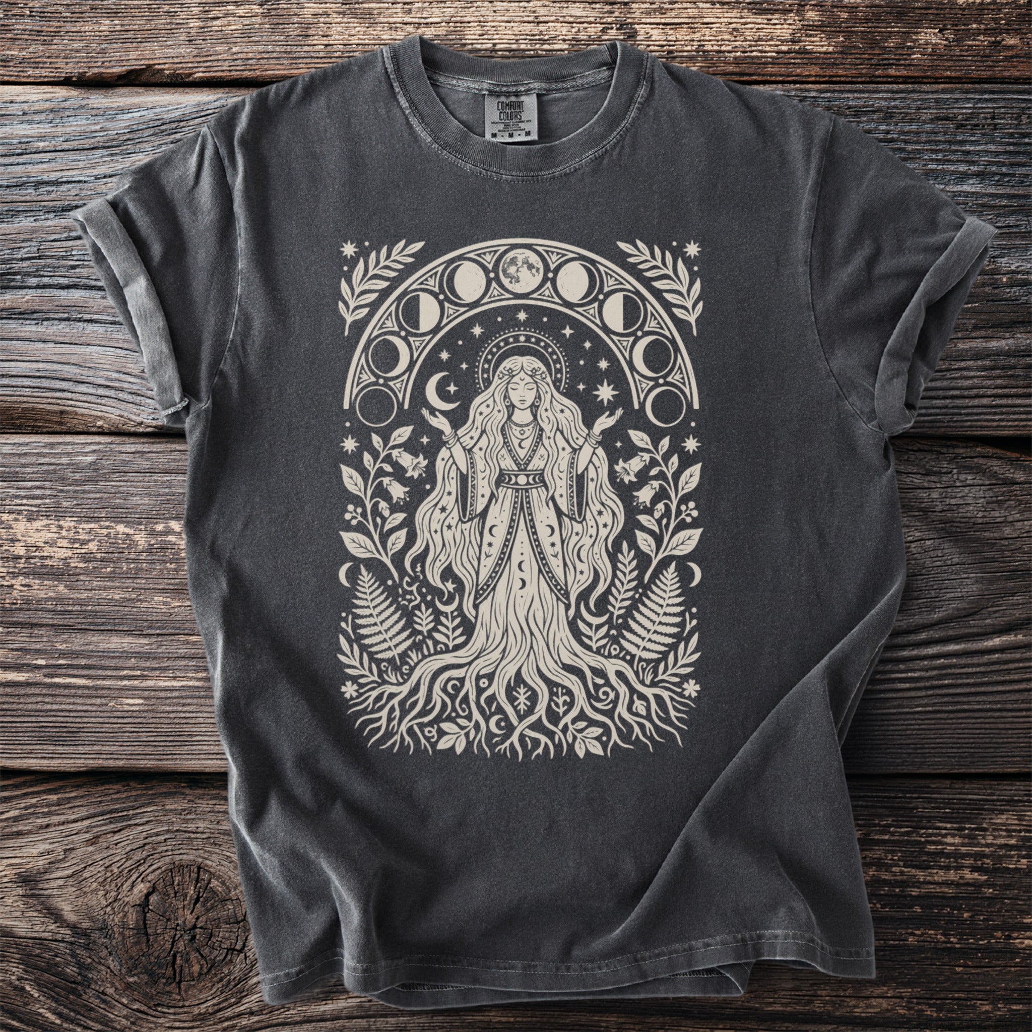 T-shirt with a celestial woman and moon phases graphic.