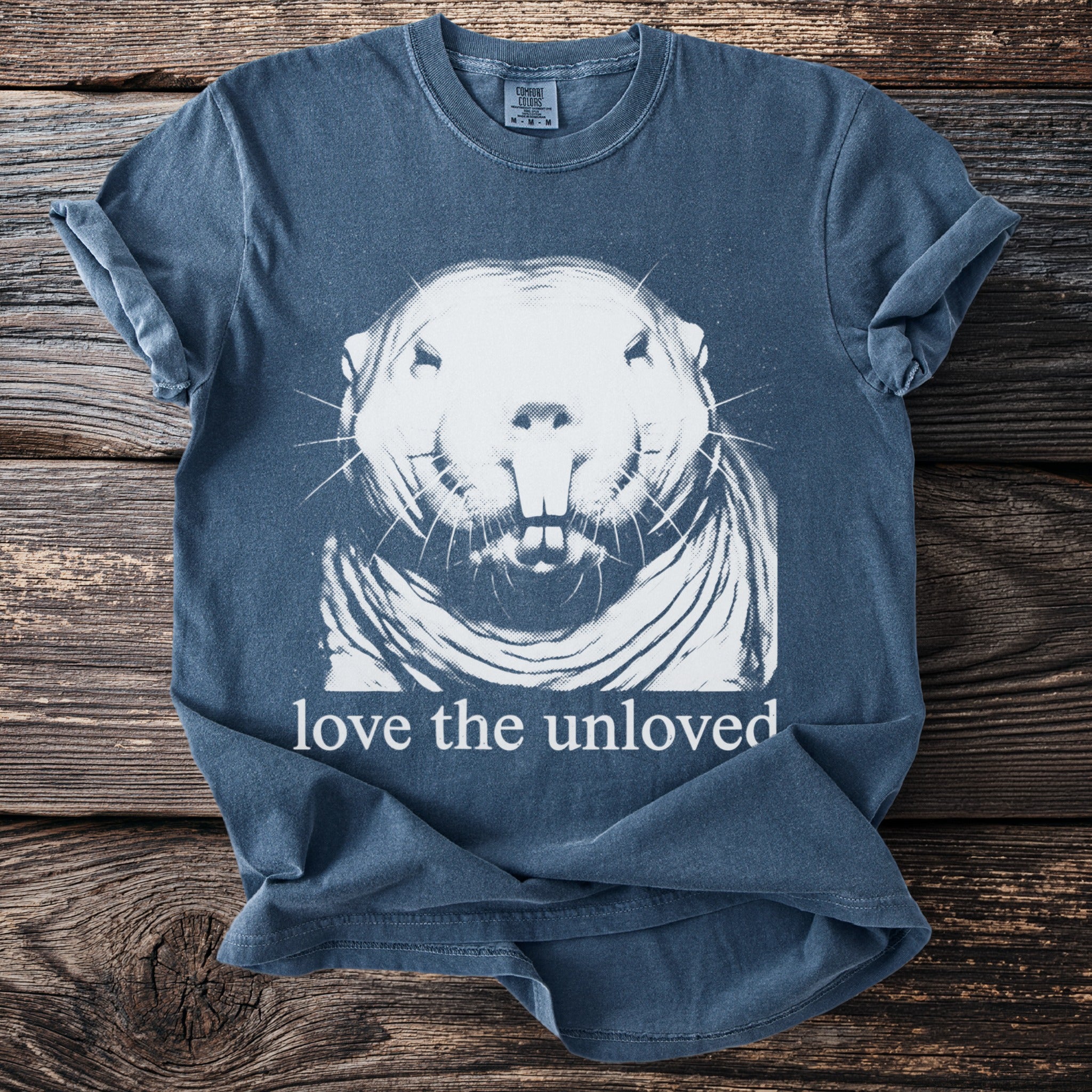 Blue t-shirt with a white graphic of a gopher and text that reads "love the unloved".