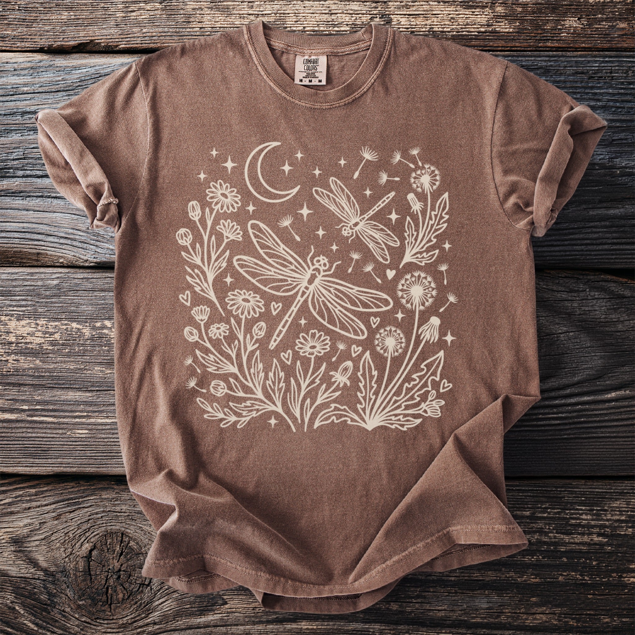 Brown t-shirt with cream dragonfly and floral design.
