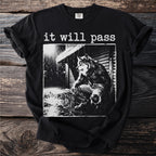 Black t-shirt with white graphic of a wolf-like creature squatting in the rain with text "it will pass".