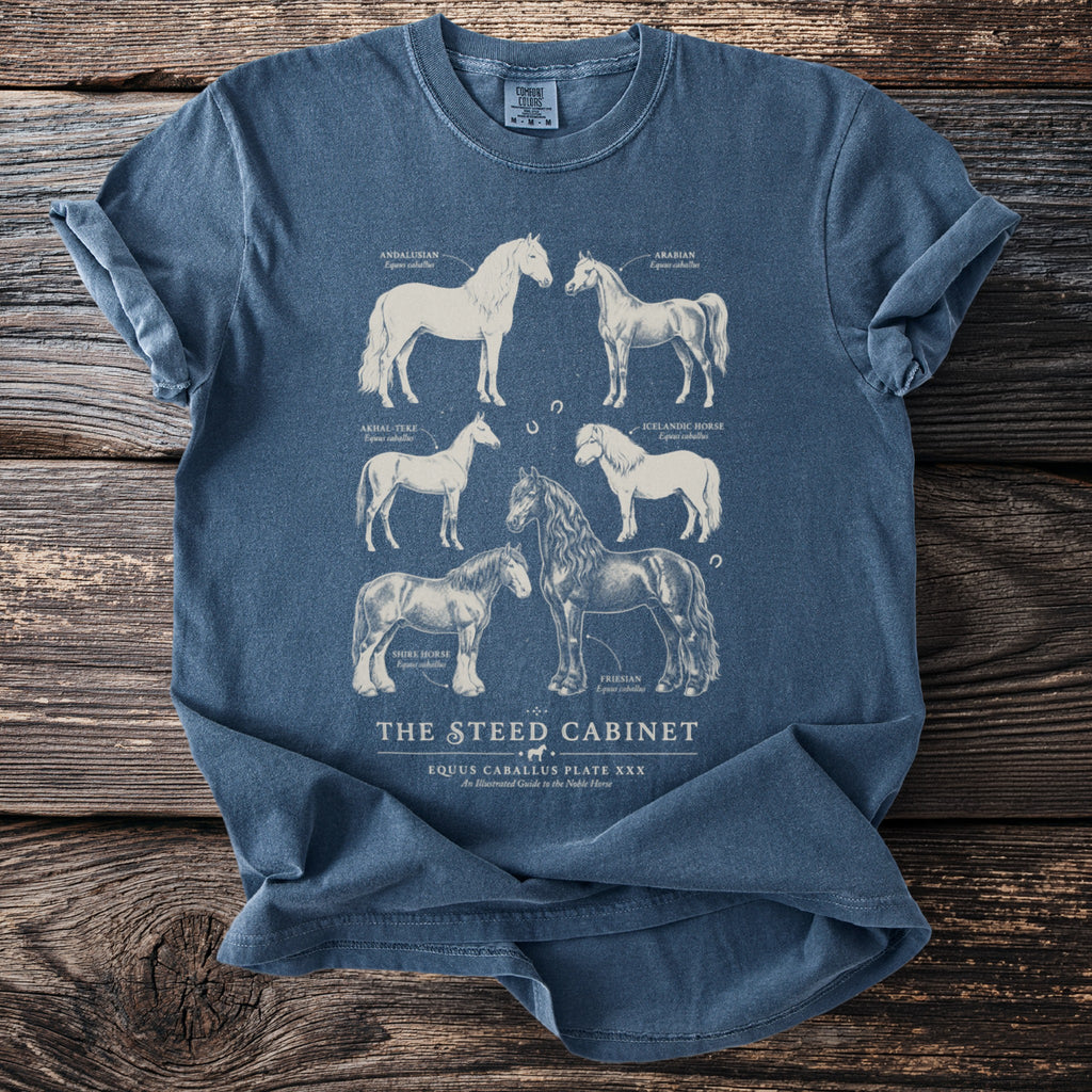 Blue t-shirt with illustrations of six horse breeds, including their names.