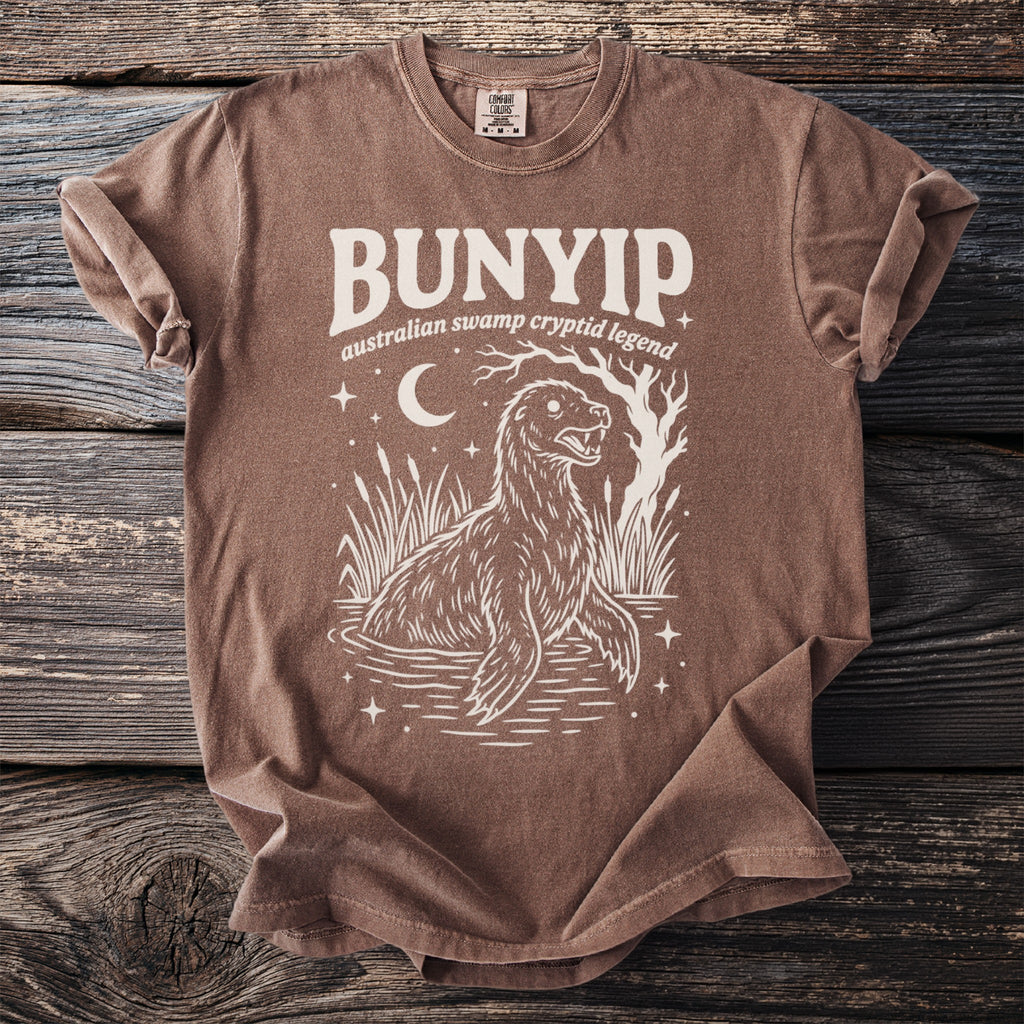 Bunyip Australian Swamp Cryptid Legend graphic t-shirt with moon and stars.