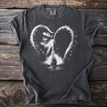 Dark t-shirt with a white Kraken heart graphic surrounding a sailing ship.
