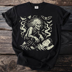 Glow-in-the-dark graphic t-shirt featuring a skeletal creature and bats over a sleeping person.