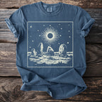 Blue t-shirt with cream circular sun and standing stones graphic.