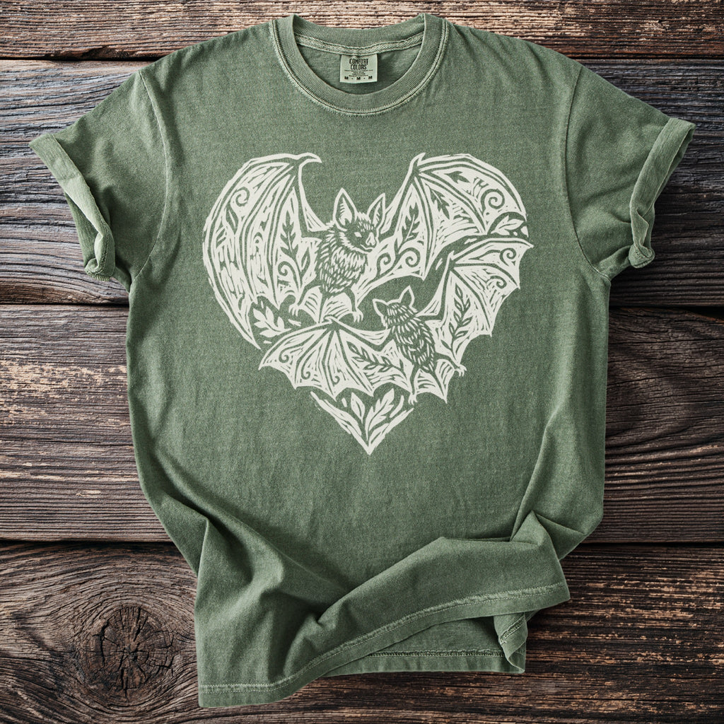 Green t-shirt with white bat heart graphic and Comfort Colors tag.