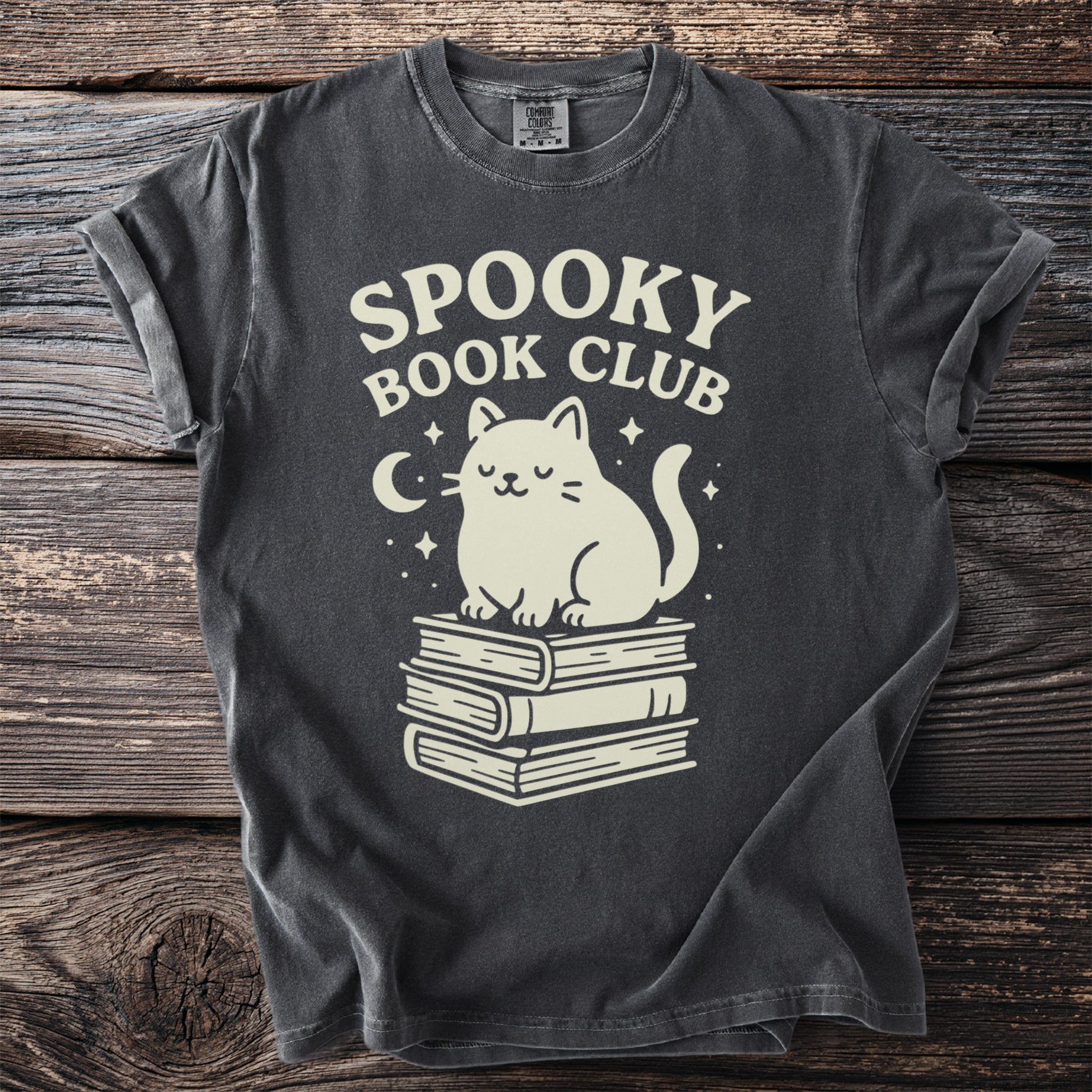 Dark gray t-shirt with "Spooky Book Club" and a cat sitting on books.