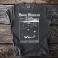Brown Mountain Lights shirt with graphic of lights in mountains, "Appalachian Nightly Shows" text.