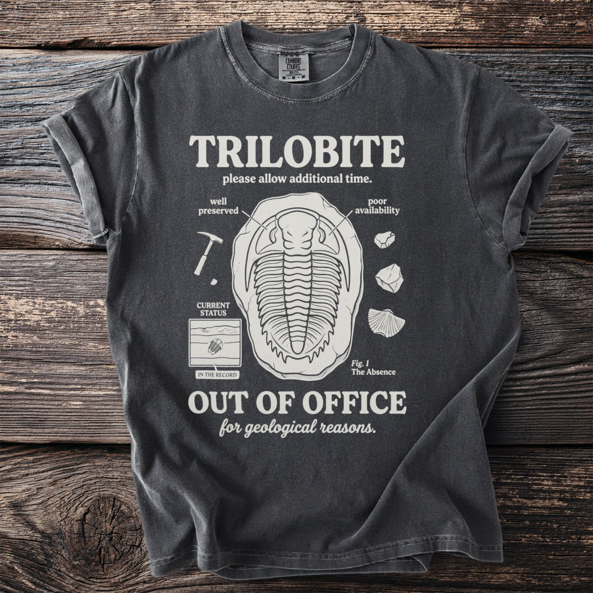 T-shirt with "TRILOBITE OUT OF OFFICE for geological reasons" and fossil illustrations.