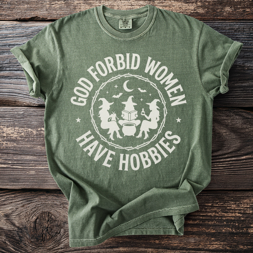 Sage t-shirt with "God forbid women have hobbies" and witch graphic.