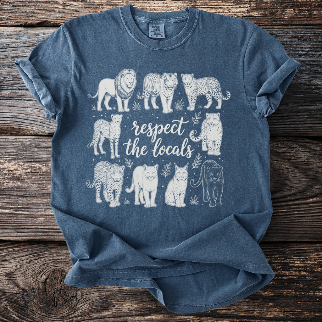 Blue t-shirt featuring line art of various big cats and the text "respect the locals."