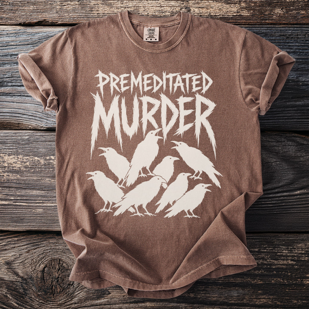 Brown t-shirt with white distressed text "PREMEDITATED MURDER" and a flock of crows.