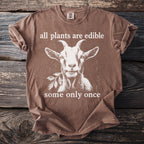 Brown t-shirt with a goat graphic and text: "all plants are edible, some only once."