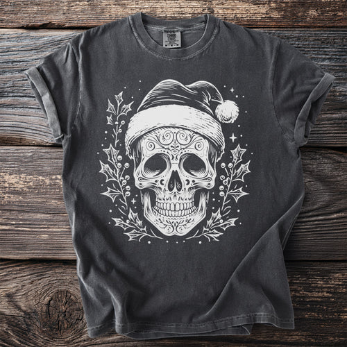 Dark t-shirt with white skull wearing Santa hat and holly graphic.