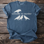 Dark blue t-shirt with white graphic of one crow above three crows and text "witness to murder".
