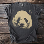 Dark t-shirt with a graphic of a panda's face in a beige and black distressed style.