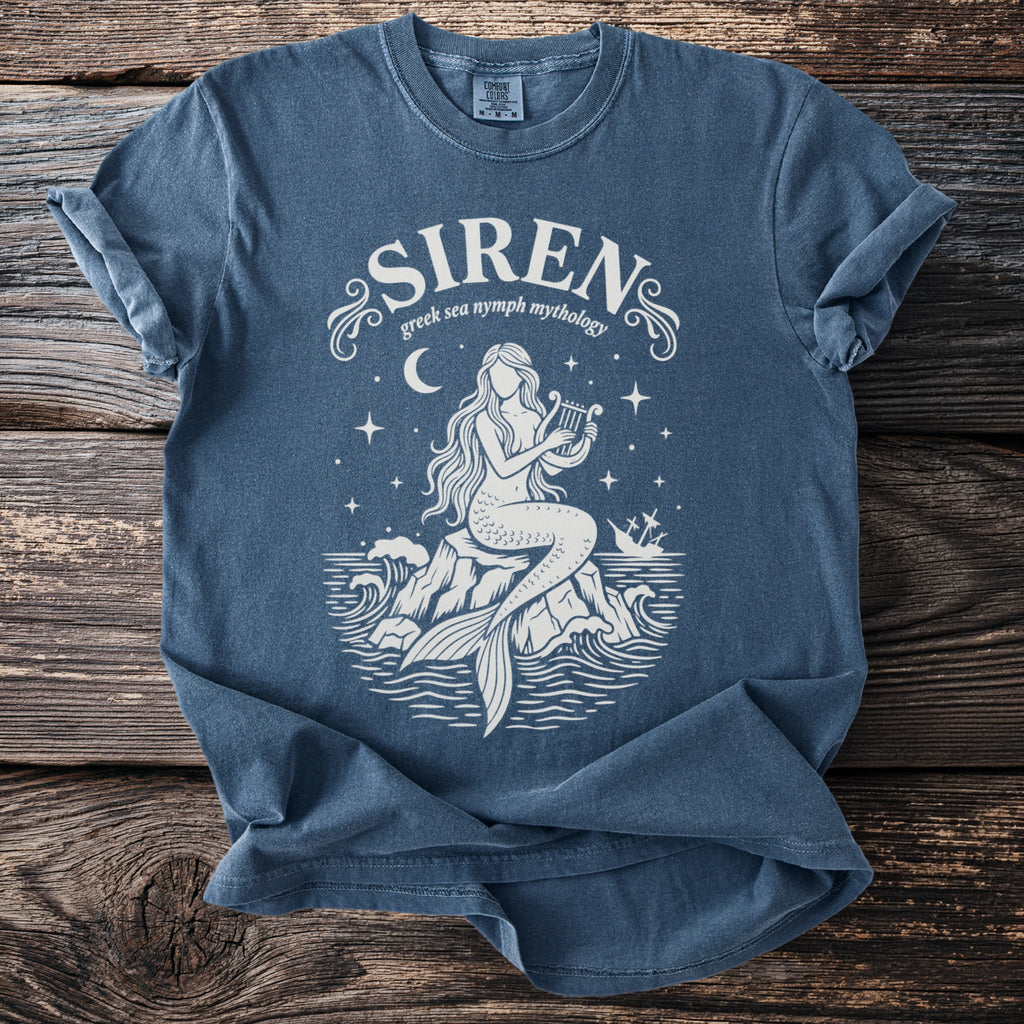 Blue t-shirt with white siren design, harp, and shipwreck, "SIREN Greek sea nymph mythology" text.