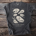Dark gray t-shirt displaying an illustration of animal skulls and the text "The Ossuary Cabinet".