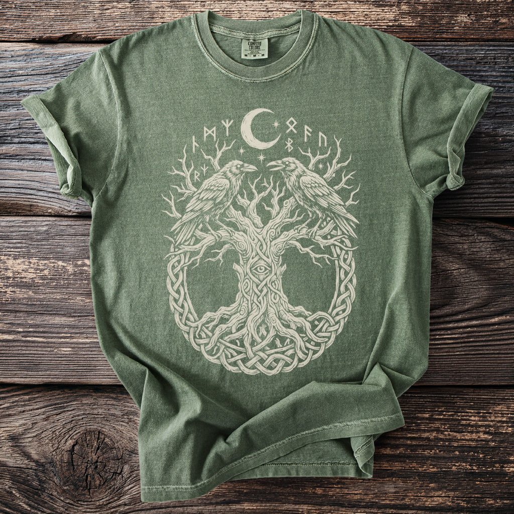 Green t-shirt with tree of life, ravens, moon, stars, and runes design.