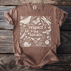 Brown t-shirt with a white floral design and the text "respect the locals" and insects.