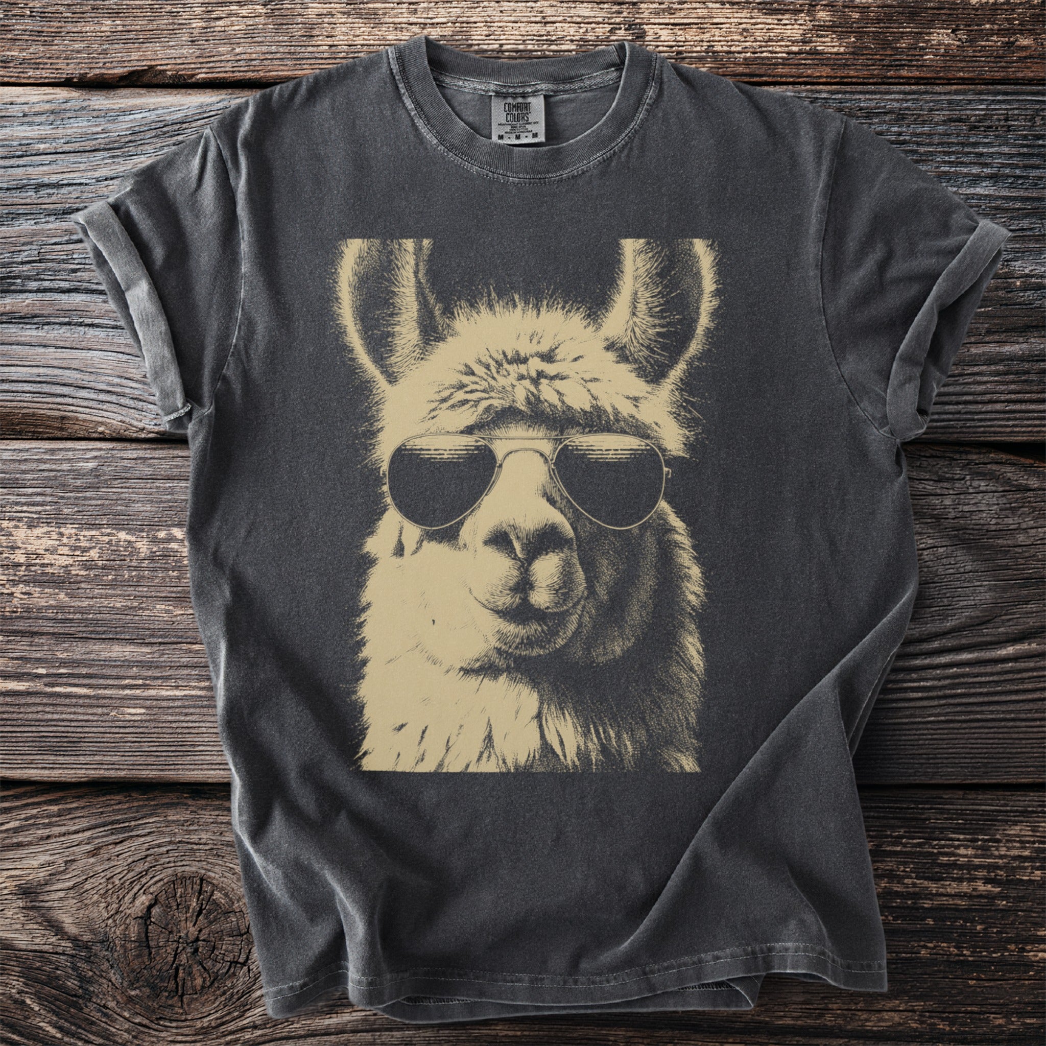 Dark grey t-shirt with a vintage-style print of a llama wearing aviator sunglasses.
