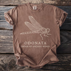 Brown t-shirt with white line drawing of a dragonfly and text "ODONATA ORDER OF ANCIENT WINGS".