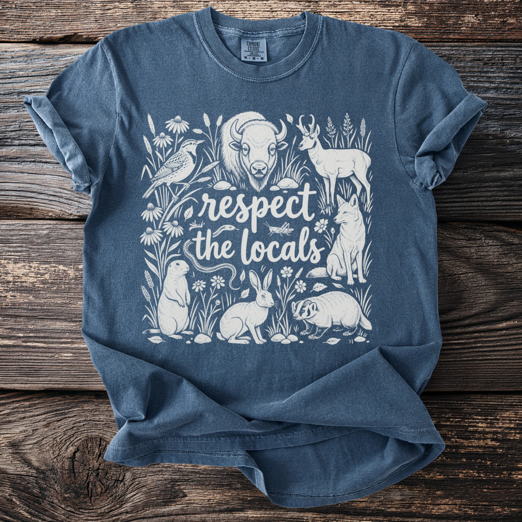 Blue t-shirt with white graphic of wildlife and "respect the locals" text.