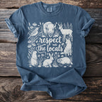 Blue t-shirt with white graphic of wildlife and "respect the locals" text.