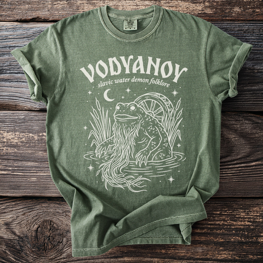 Green t-shirt with white Vodyanoy Slavic water demon folklore design.