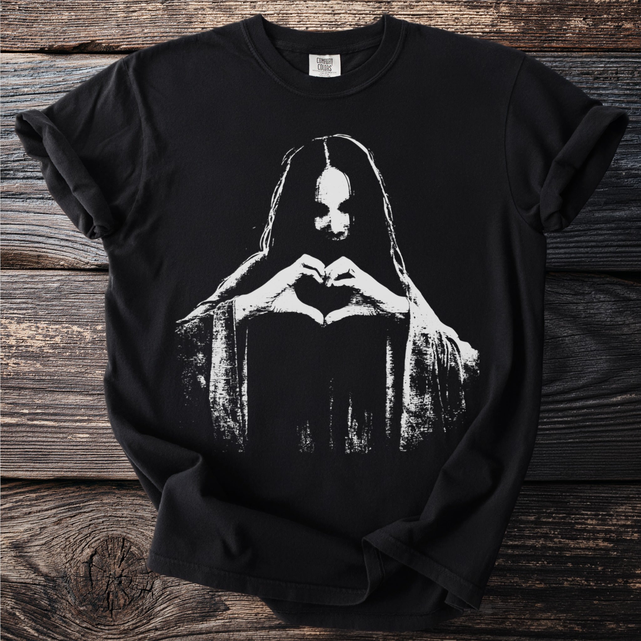 Black t-shirt with white graphic of a person forming a heart with their hands.
