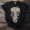 Black t-shirt with a beige wood grain hammer design and foliage.