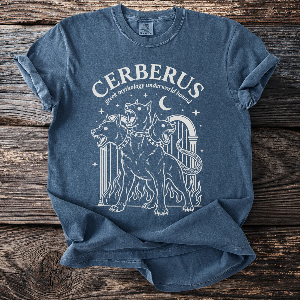 Blue t-shirt with white graphic of three-headed Cerberus and text "CERBERUS greek mythology underworld hound".