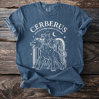 Blue t-shirt with white graphic of three-headed Cerberus and text "CERBERUS greek mythology underworld hound".