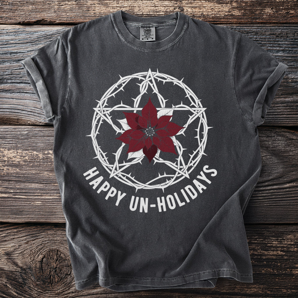 Dark gray t-shirt with white pentagram, poinsettia, and text "HAPPY UN-HOLIDAYS".