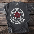 Dark gray t-shirt with white pentagram, poinsettia, and text "HAPPY UN-HOLIDAYS".