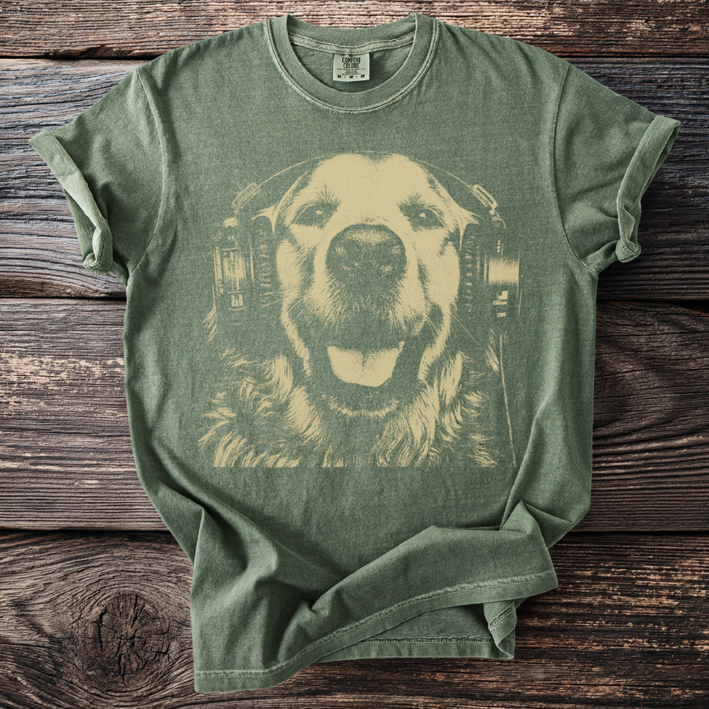 Green t-shirt with a cream-colored graphic of a happy dog wearing headphones.