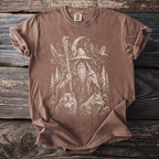 Brown t-shirt with a graphic of a wizard, wolves, ravens, and runes.