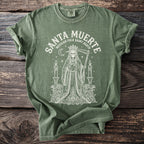 Green t-shirt with Santa Muerte Mexican Folk Saint Death design.