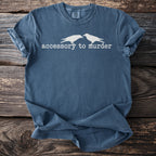 Blue t-shirt with white crows and "accessory to murder" text.