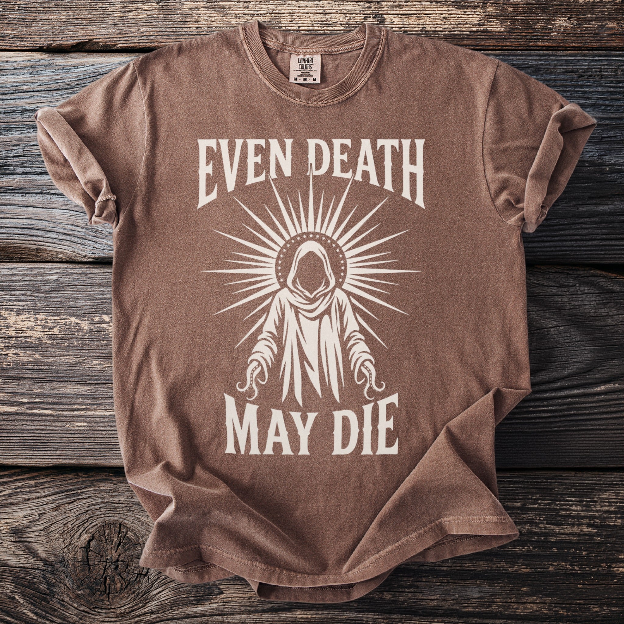 Brown t-shirt with white text "EVEN DEATH MAY DIE" and a hooded figure.
