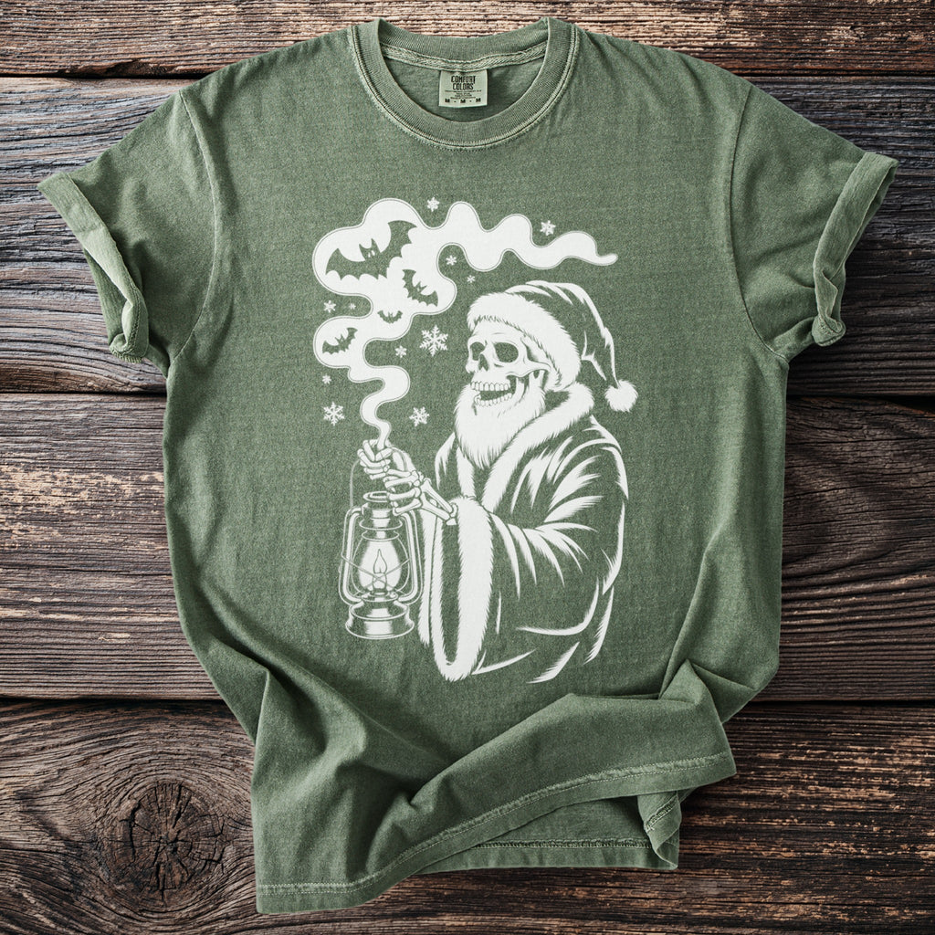 Green t-shirt with a white skeleton Santa holding a lantern surrounded by bats and snowflakes.